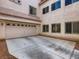 Attached two-car garage with driveway and plentiful windows at 1115 Aldenwood Ave, Las Vegas, NV 89123
