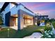 Beautiful backyard features a putting green, lounge area, spiral staircase and lush landscaping at 11152 San Terrazo Pl, Las Vegas, NV 89141