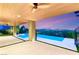 Outdoor living space featuring a covered patio, ceiling fans, and a tranquil pool view at 11152 San Terrazo Pl, Las Vegas, NV 89141