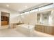 A spacious bathroom featuring a soaking tub, double vanities, and a walk-in closet at 11152 San Terrazo Pl, Las Vegas, NV 89141