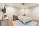 Well lit bedroom featuring hardwood floors and neutral-colored walls at 11152 San Terrazo Pl, Las Vegas, NV 89141