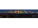 Breathtaking panoramic view of the city skyline at night, showcasing the vibrant lights and urban landscape at 11152 San Terrazo Pl, Las Vegas, NV 89141