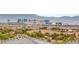 Expansive daytime view of the cityscape featuring iconic landmarks set against a backdrop of rolling hills and clear skies at 11152 San Terrazo Pl, Las Vegas, NV 89141