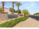 View of The Bluffs community entrance with desert landscaping and signage at 11152 San Terrazo Pl, Las Vegas, NV 89141