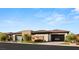 Beautiful single-story home with modern design, glass garage doors, and well-maintained landscaping at 11152 San Terrazo Pl, Las Vegas, NV 89141