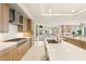 Modern kitchen with stainless steel appliances, custom cabinets, and an island with a sink at 11152 San Terrazo Pl, Las Vegas, NV 89141
