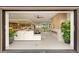 Open-concept living space featuring a modern fireplace, seamless access to the kitchen, and an abundance of natural light at 11152 San Terrazo Pl, Las Vegas, NV 89141
