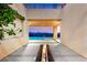 Modern outdoor space with a pool view, linear fire pit and sleek design elements at 11152 San Terrazo Pl, Las Vegas, NV 89141