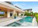 Luxury backyard oasis featuring a sparkling pool, integrated spa, and ample lounge space at 11152 San Terrazo Pl, Las Vegas, NV 89141