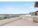 Modern outdoor kitchen on a rooftop deck, complete with stainless steel grill, refrigerator, and stunning city views at 11152 San Terrazo Pl, Las Vegas, NV 89141
