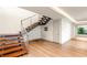 Modern staircase featuring wood steps, with steel railings and hardwood floors throughout at 11152 San Terrazo Pl, Las Vegas, NV 89141
