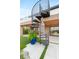 Elegant spiral staircase leading to a rooftop deck and outdoor living space at 11152 San Terrazo Pl, Las Vegas, NV 89141