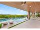 Covered patio with an in-ground swimming pool and luxurious lounge chairs at 11152 San Terrazo Pl, Las Vegas, NV 89141
