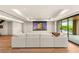 Home theater with a large screen, a comfortable sofa, and access to the outdoor area at 11152 San Terrazo Pl, Las Vegas, NV 89141