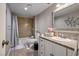 Cozy bathroom featuring tile walls, shower-tub, and a granite vanity countertop at 138 Palma Del Rio, Las Vegas, NV 89110