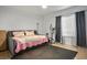 Comfortable bedroom featuring tiled floor, a daybed, exercise equipment, and ample natural light at 138 Palma Del Rio, Las Vegas, NV 89110