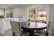 Bright dining area featuring neutral tones, ample natural light, and a view to the backyard at 138 Palma Del Rio, Las Vegas, NV 89110