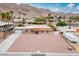 Aerial view of single-story house with well-kept desert landscaping in front of the property at 138 Palma Del Rio, Las Vegas, NV 89110