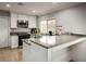 Well-lit kitchen featuring a stainless steel microwave, range and ample counter space for meal preparation at 138 Palma Del Rio, Las Vegas, NV 89110