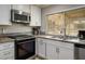 Bright kitchen with stainless steel appliances and ample counter space for preparing meals at 138 Palma Del Rio, Las Vegas, NV 89110