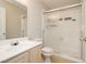 Bathroom with white fixtures, shower, and sink at 1617 Cave Spring Dr, Henderson, NV 89014