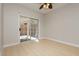 Empty bedroom with sliding glass doors to the backyard and light wood flooring at 1617 Cave Spring Dr, Henderson, NV 89014