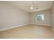 Large bedroom with natural lighting, hard wood floors and ceiling fan at 1617 Cave Spring Dr, Henderson, NV 89014