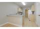 Compact kitchen featuring ample counter space, white appliances, and light wood flooring at 1617 Cave Spring Dr, Henderson, NV 89014