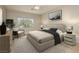 Cozy main bedroom with neutral tones and a large window at 1617 Cave Spring Dr, Henderson, NV 89014