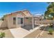 This private backyard features a covered patio and low-maintenance desert landscaping at 1705 Imperial Cup Dr, Las Vegas, NV 89117