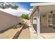 Enjoy the backyard's covered patio, landscaped with crushed stone and low-water plants at 1705 Imperial Cup Dr, Las Vegas, NV 89117