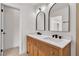 Elegant bathroom with double sinks, modern fixtures, and a classic design at 1705 Imperial Cup Dr, Las Vegas, NV 89117