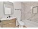 Modern bathroom with new tiling, updated vanity and fixtures, plus a shower and tub at 1705 Imperial Cup Dr, Las Vegas, NV 89117