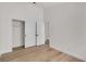 Bright bedroom features hardwood floors, a large closet, and neutral walls at 1705 Imperial Cup Dr, Las Vegas, NV 89117
