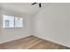 Bedroom with neutral walls, modern ceiling fan and hardwood floors at 1705 Imperial Cup Dr, Las Vegas, NV 89117