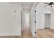 Hallway features hardwood floors, white walls, and doors leading to various rooms at 1705 Imperial Cup Dr, Las Vegas, NV 89117