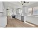 Bright kitchen with white cabinets, stainless steel appliances, and quartz countertops at 1705 Imperial Cup Dr, Las Vegas, NV 89117