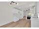 Modern kitchen features white cabinets, stainless steel appliances and hardwood floors at 1705 Imperial Cup Dr, Las Vegas, NV 89117