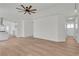Open-concept living area with wood-look floors and neutral wall paint at 1705 Imperial Cup Dr, Las Vegas, NV 89117