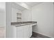 Modern bathroom featuring gray countertops, stylish vanity, and luxury vinyl flooring at 1720 Sandia Rock Ave, North Las Vegas, NV 89032