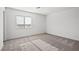 Sun-drenched empty bedroom with neutral carpet, offering a blank canvas for personal design at 1720 Sandia Rock Ave, North Las Vegas, NV 89032