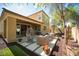 Covered back patio featuring an outdoor seating and landscaped yard at 2198 Maderno St, Henderson, NV 89044