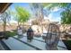 Outdoor seating area with synthetic grass, fire pit and landscaping at 2198 Maderno St, Henderson, NV 89044