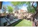 Backyard featuring pavers, faux grass, and planters at 2198 Maderno St, Henderson, NV 89044