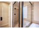 Modern bathroom showing a glass-enclosed shower with sleek black fixtures at 2198 Maderno St, Henderson, NV 89044