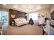 Cozy bedroom featuring wood accent wall, daybed, and natural light at 2198 Maderno St, Henderson, NV 89044