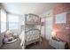 Charming bedroom featuring a gray bunk bed and pink flower wall at 2198 Maderno St, Henderson, NV 89044