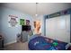 Blue bedroom with closet and comic themed wall art at 2198 Maderno St, Henderson, NV 89044