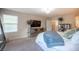 Stylish bedroom with mirrored dresser and large television for modern comfort at 2198 Maderno St, Henderson, NV 89044