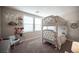 Bright bedroom with a gray bunk bed, wall decorations, and two windows at 2198 Maderno St, Henderson, NV 89044